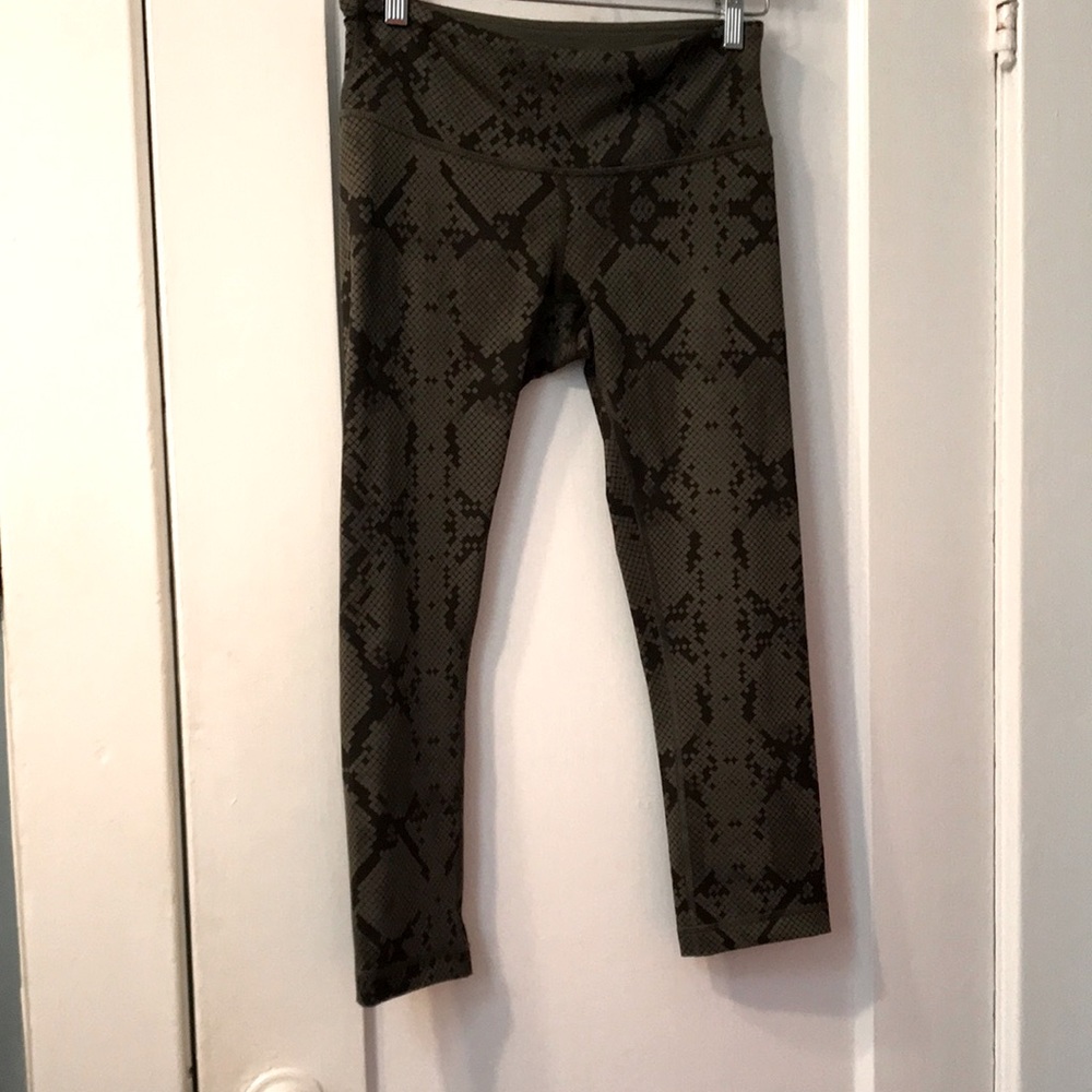 Lululemon Yoga pants in green geometric camouflage pattern.
